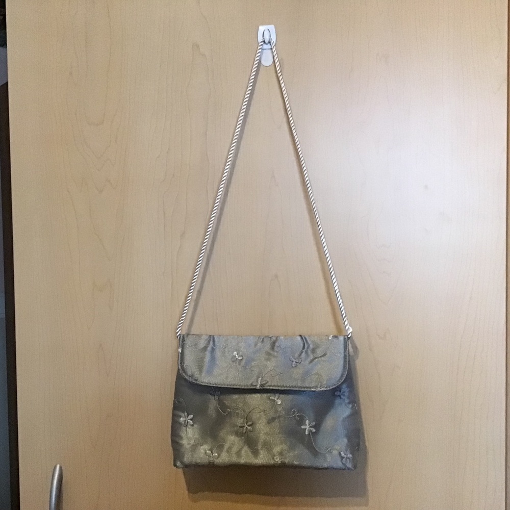 Satin embroidered evening bag with white corded handle